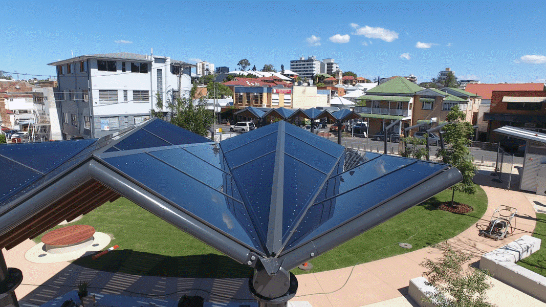 The Westend Common walkway shade structure featuring a polycarbonate roof, manufactured, and installed by Versatile Structures