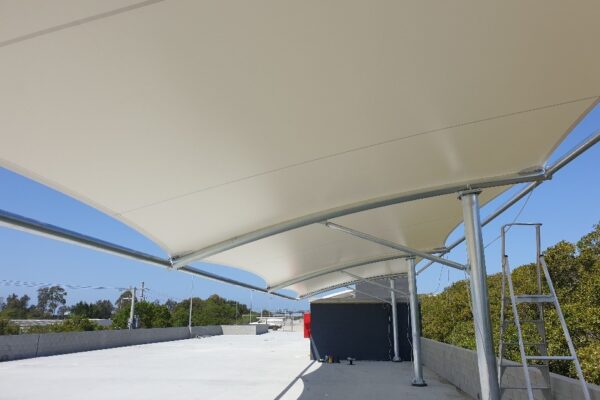 Waterproof car park shade structure installed by Versatile Structures