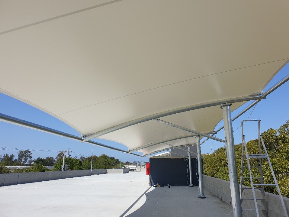 Waterproof car park shade structure installed by Versatile Structures