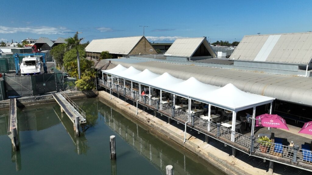 Undercover seating area for Kawana Hotel designed, manufactured and installed by Versatile Structures